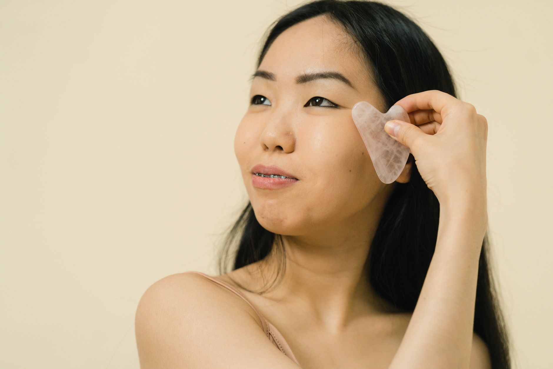gua sha facial massage closeup — Luxury Lashes Federal Way WA